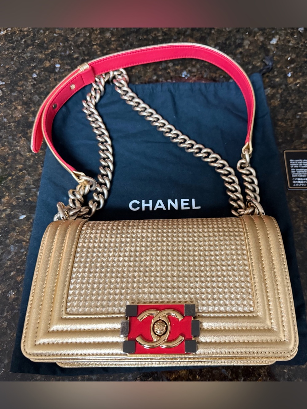CHANEL Gold Quilted Shoulder Bag with Red Accents